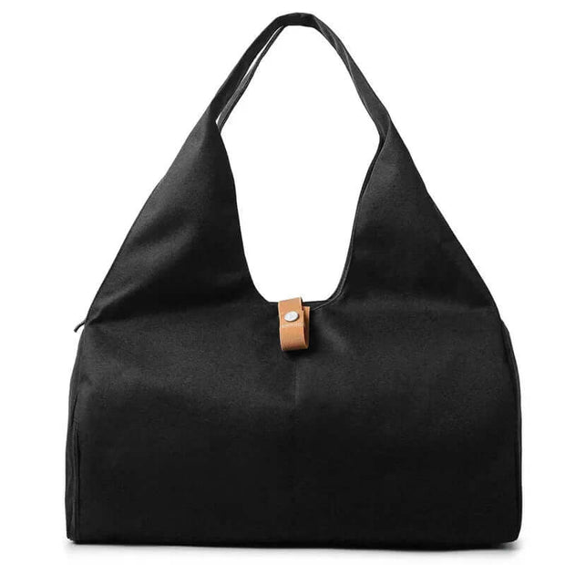 Stylish black waterproof sports bag for women, perfect for gym, yoga, and weekend getaways.